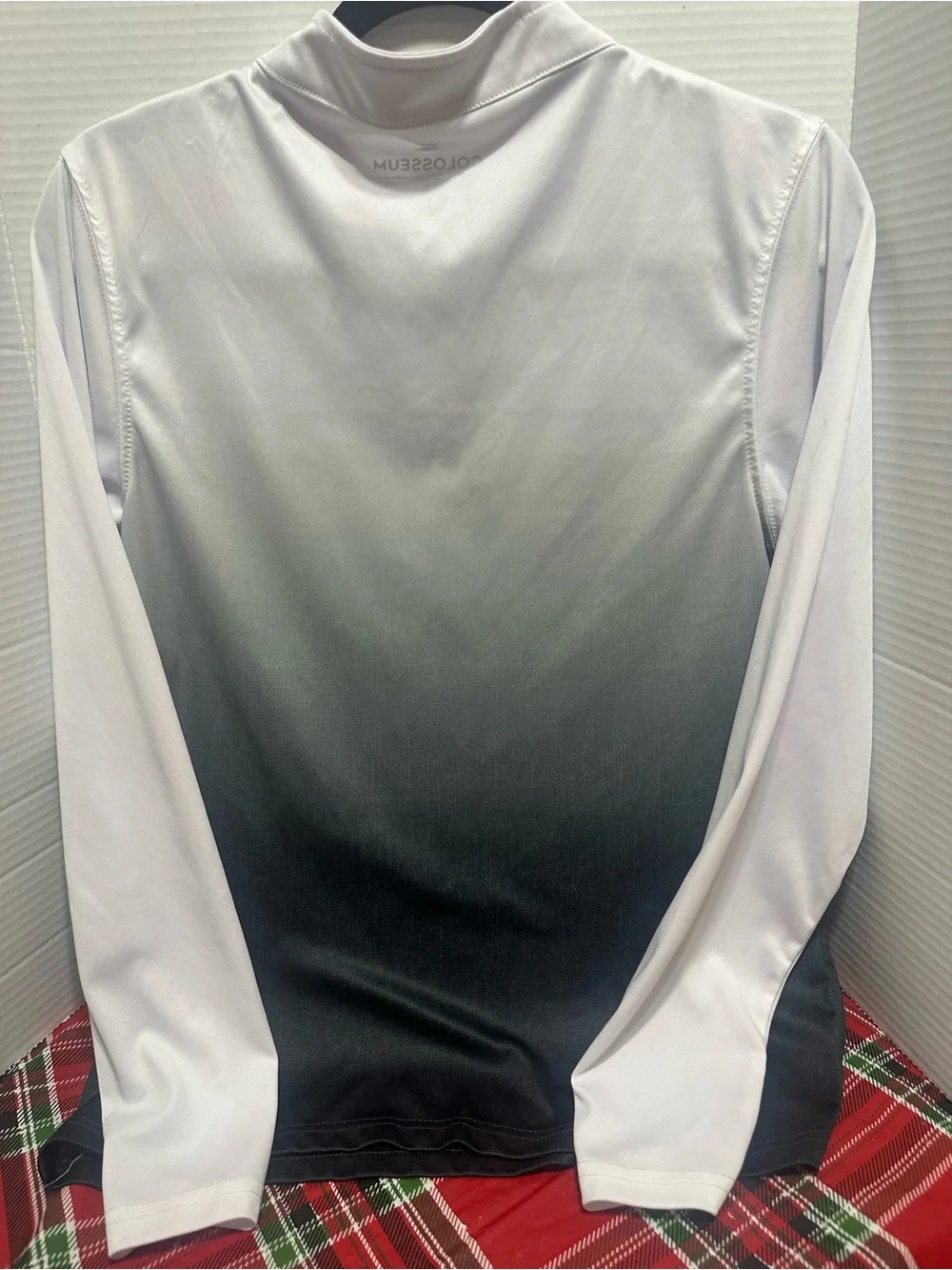 Two K-State Colosseum Youth XL quarter zips.
